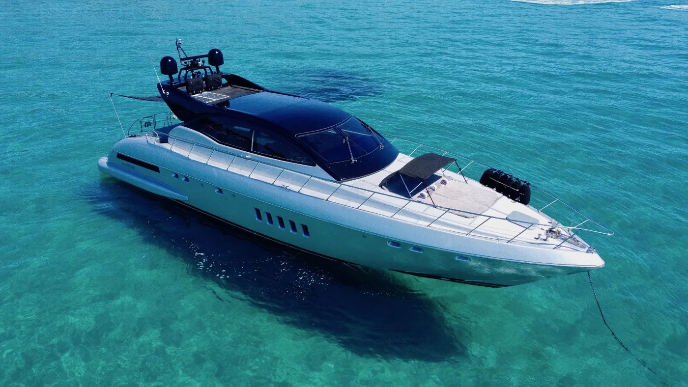 A yacht at anchor in turquoise water