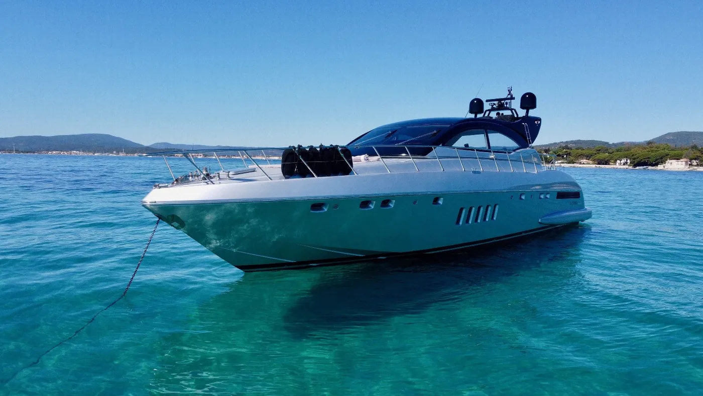 A yacht offshore, the coast of the Var in the background